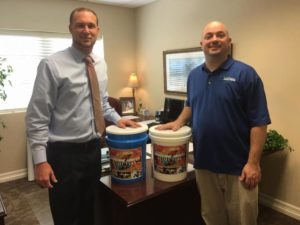 Dustin Beavers, Jaycees Treasurer, and Richard Shade, Jaycees Past President, pose for a photo with the Jaycees Hurricane Harvey Relief coin collection buckets. Donations will be collected through the end of September at Austin Bank, 3120 North St., and Commercial Bank of Texas, 215 E Main St.