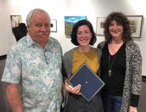 David Cozadd, president of the SFA Friends of the Visual Arts board, and Linda Mock, FVA scholarship committee chair, present the Charles D. Jones Art Scholarship to Sarah Jentsch, senior printmaking student from Etoile.