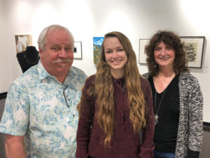 David Cozadd, president of the SFA Friends of the Visual Arts board, and Linda Mock, FVA scholarship committee chair, present the Gary Parker Art Scholarship to Shelby Locklin, junior sculpture student from South Lake.