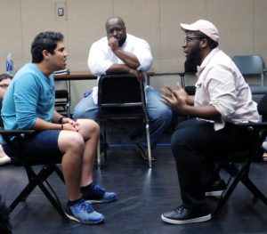 Cleo House Jr., center, director of the SFA School of Theatre, works with Manvel senior Edwin "EJ" Villanueva, left, and Webster senior Tyler Canada, right, as they rehearse a scene from the School of Theatre's upcoming play, "Sweat" by Lynn Nottage, while Copperas Cove senior Sarah Wiseman looks on.