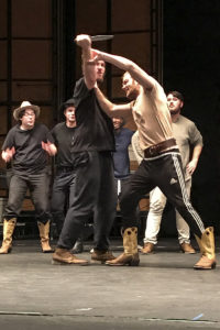  Theatre students Richard Rogers of Kerrville as Jud and exchange student Thomas Falconar of Gillingham, Gabon Republic, Africa, as Curly rehearse a fight scene in "Oklahoma!" with Shane Reynolds of Cumming, Georgia, Trace Killian of Forney, Myles Sands of Rosenberg and Tommy Vest of Gunter in the background.