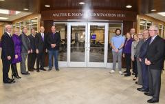  Members of Stephen F. Austin State University’s Board of Regents and university administrators stand with alumnus Walter E. “Loddie” Naymola during a dedication ceremony celebrating the Walter E. Naymola Innovation Hub. Pictured, left to right, are regents Tom Mason, Nelda Luce Blair (secretary), Dr. Scott Coleman, David Alders, Dr. Steve Westbrook (interim university president), Walter E. Naymola, Zane Naymola (Walter’s son and SFA sophomore), Brigettee Henderson (chair), Dr. Tim Bisping (dean of the Rusche College of Business), Karen Gantt, Kate Childress (student regent), Ken Schaefer and Bob Garrett. 