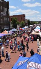 Festival attendees walk through vendor booths on Main Street in historic downtown Nacogdoches during the Texas Blueberry Festival presented by Tipton Ford-Lincoln. (Photo by Anna Laura Daniel)
