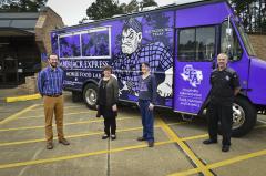 Stephen F. Austin State University faculty members Justin Pelham, clinical instructor; Dr. Chay Runnels, hospitality administration program coordinator and associate professor; Dr. Donna Fickes, clinical instructor; and Todd Barrios, chef instructor; were instrumental in creating the Lumberjack Express, a mobile food lab, which offers service Tuesdays and Thursdays.