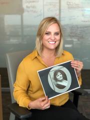  Stephen F. Austin State University alumna Heather Dulin holds a photograph of her great-grandmother, Ibby Inez Fuller, who attended the university in the 1920s. While separated by nearly a century, the two shared a Lumberjack bond through their SFA experiences.