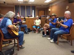 Pickin' on the Square at the Texas Blueberry Festival is from 11 a.m. to 2 p.m. on Saturday, June 8. Find groups in two locations, City Council Chambers at City Hall (pictured) and the community room at Regions Bank. The event is open to all who would like to join with an instrument or to take a seat, enjoy the music and rest in the air-conditioned venues for a cool-down break during the festival day! (Photo by Scott Waller)