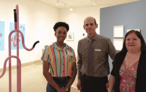  SFA senior art major Typhanie Shepherd of Lufkin, left, has been awarded this year's William Arscott Art Scholarship by the Friends of the Visual Arts at SFA. With Shepherd are Christopher Talbot, director of the SFA School of Art, and Crystal Hicks, FVA president.