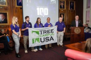 Arthur Temple College of Forestry and Agriculture Dean Hans Williams, forestry professor David Kulhavy, and forestry students Devin Stage, Miranda Cleveland, Christian Boser and Morgan Metcalf presented Stephen F. Austin State University’s Board of Regents with an Arbor Day banner at their meeting in April to recognize SFA’s Tree Campus Higher Education distinction.